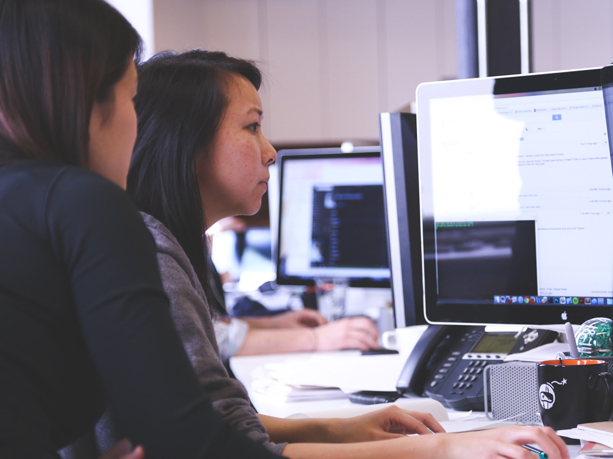 2 female animators looking at a computer screen